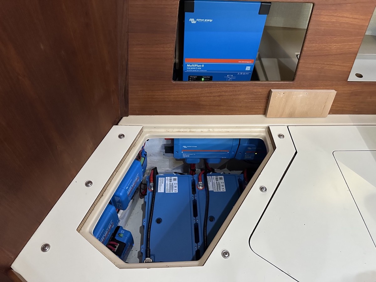 Victron inverter charger and lithium battery installation inside a cruising yacht