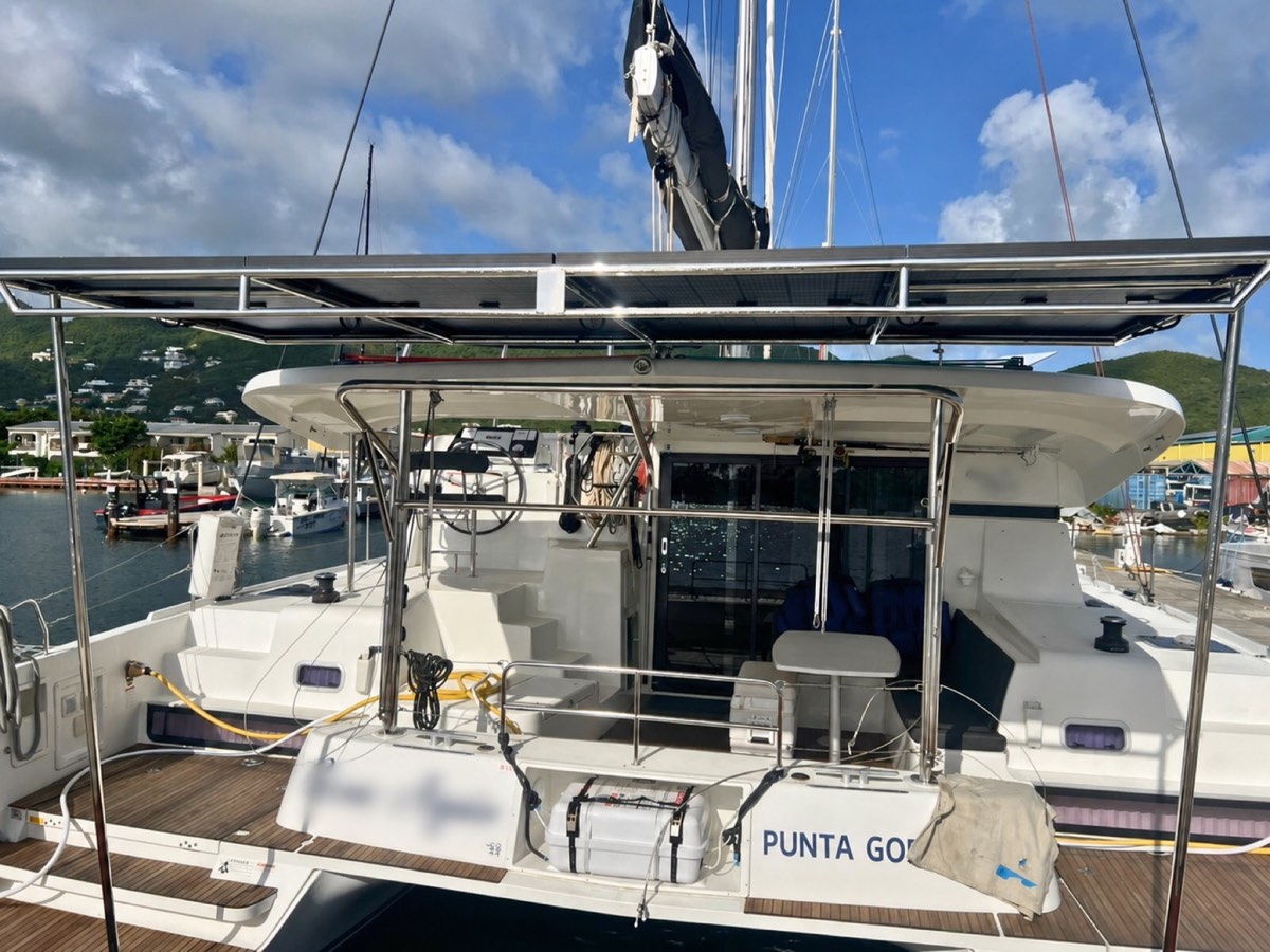 Catamaran in St. Maarten with a stainless solar arch and roof-mounted solar array